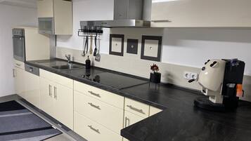 Dishwasher, coffee/tea maker, cookware/dishes/utensils