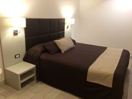 Premium bedding, down comforters, in-room safe, desk