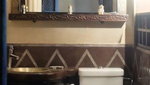 A bathroom with a sink, toilet, and a mirror above the sink. - Eden Palm Resident Marrakech (Marrakech)