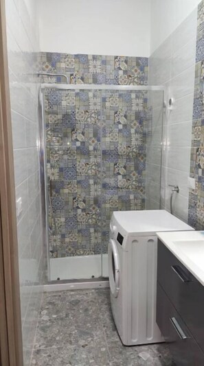 Shower, bidet, towels, soap