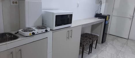 Fridge, microwave, cookware/dishes/utensils