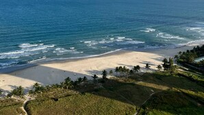 A beach with clear skies and calm waters. - Luxury 2BR Apartment with Ocean view (Đà Nẵng)