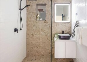 Shower, hair dryer, towels