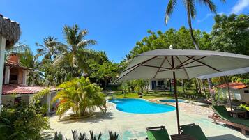 Outdoor pool, pool umbrellas, sun loungers