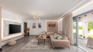 A modern living room with a large flat-screen TV, a sectional sofa, a coffee table, and a large window with curtains. - Charming Villa Filton with swimming pool, sauna and jacuzzi (Markovici)