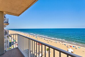 A balcony with a view of a beach and ocean. - Panoramic Ocean Views | Modern Kitchen|Heated Pool 1304 (Virginia Beach)
