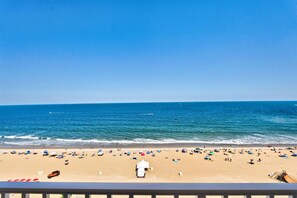 A beach with a clear sky, a sandy shore, and a view of the ocean. - Panoramic Ocean Views | Modern Kitchen|Heated Pool 1304 (Virginia Beach)
