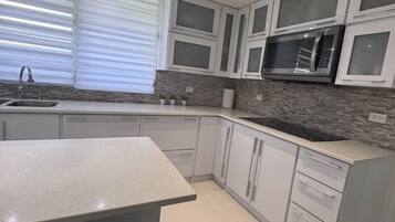 Fridge, microwave, stovetop, coffee/tea maker