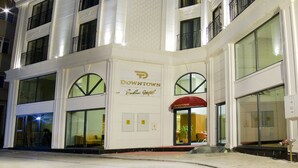 A multi-story hotel with a prominent 'Downtown' sign, large windows, and a corner entrance. - Downtown Sirkeci Hotel (Istanbul)
