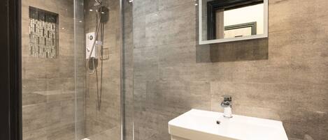 Shower, hair dryer, towels, soap
