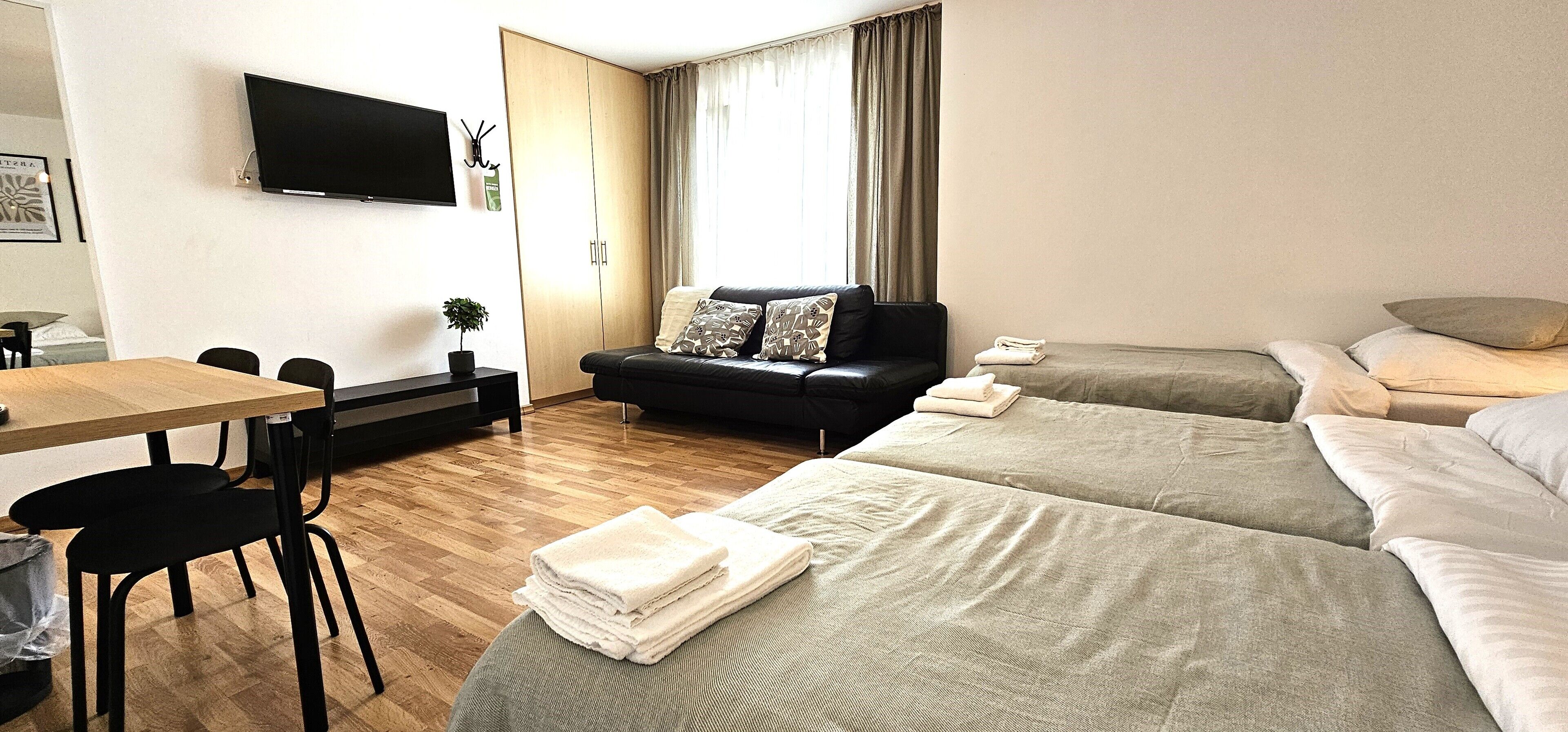 Basic Triple Room, Courtyard View | In-room safe, desk, free WiFi
