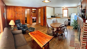 Deluxe Cabin | Living area | 50-inch Smart TV with digital channels, fireplace - Benzonia Rustic Resort (Benzonia)