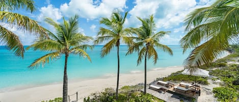On the beach, sun loungers, beach towels