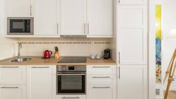 Basic Apartment | Private kitchen | Full-size fridge, dishwasher, cookware/dishes/utensils