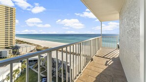 A balcony with a view of the beach and ocean. - The Summit 1032 (Panama City Beach)