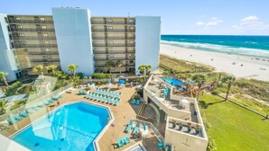 A hotel with a pool, beach view, and multiple floors. - Top Of The Gulf 613 (Panama City Beach)