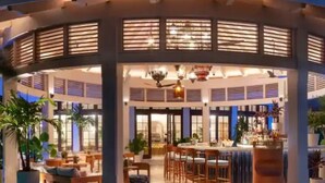 A covered outdoor area with a bar, seating, and a pool. - NEWLy RENOVaTED! COMPLImentary CAR! Casa Bonita! (Nassau)