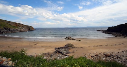 Teach Condy's Cottage nestled at the bottom of Sliabh Liag Cliffs, Co. Donegal