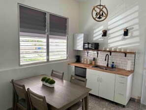 Fridge, microwave, stovetop, cookware/dishes/utensils