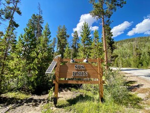 Discover the serene beauty of STS. JOHN, nestled among towering pine trees.