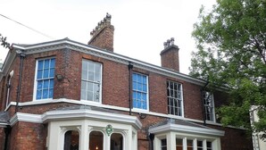A two-story brick house with a bay window and a conservatory. - Claremont The Matcham (Leeds)