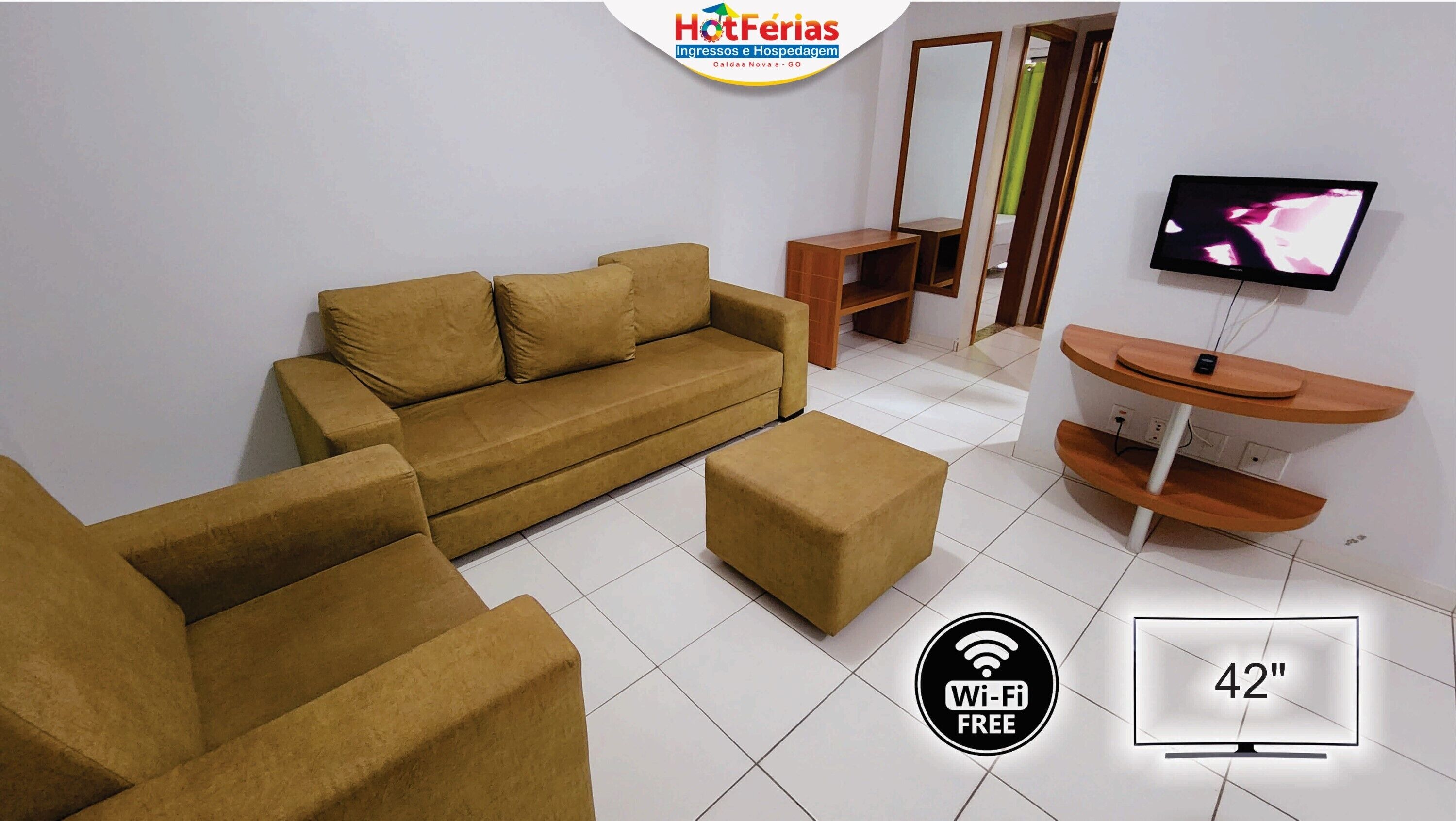 Apartamento família, sacada, vista para a cidade | Sala de estar