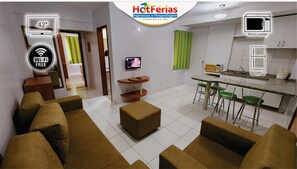 Family Apartment, Balcony, City View | Living room | TV - Golden Dolphin GrandHotel - Piscinas 24h (Caldas Novas)