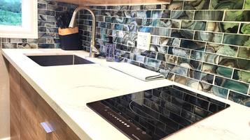 Fridge, microwave, stovetop, coffee/tea maker