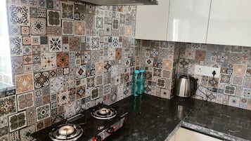 Microwave, stovetop, cookware/dishes/utensils, spices