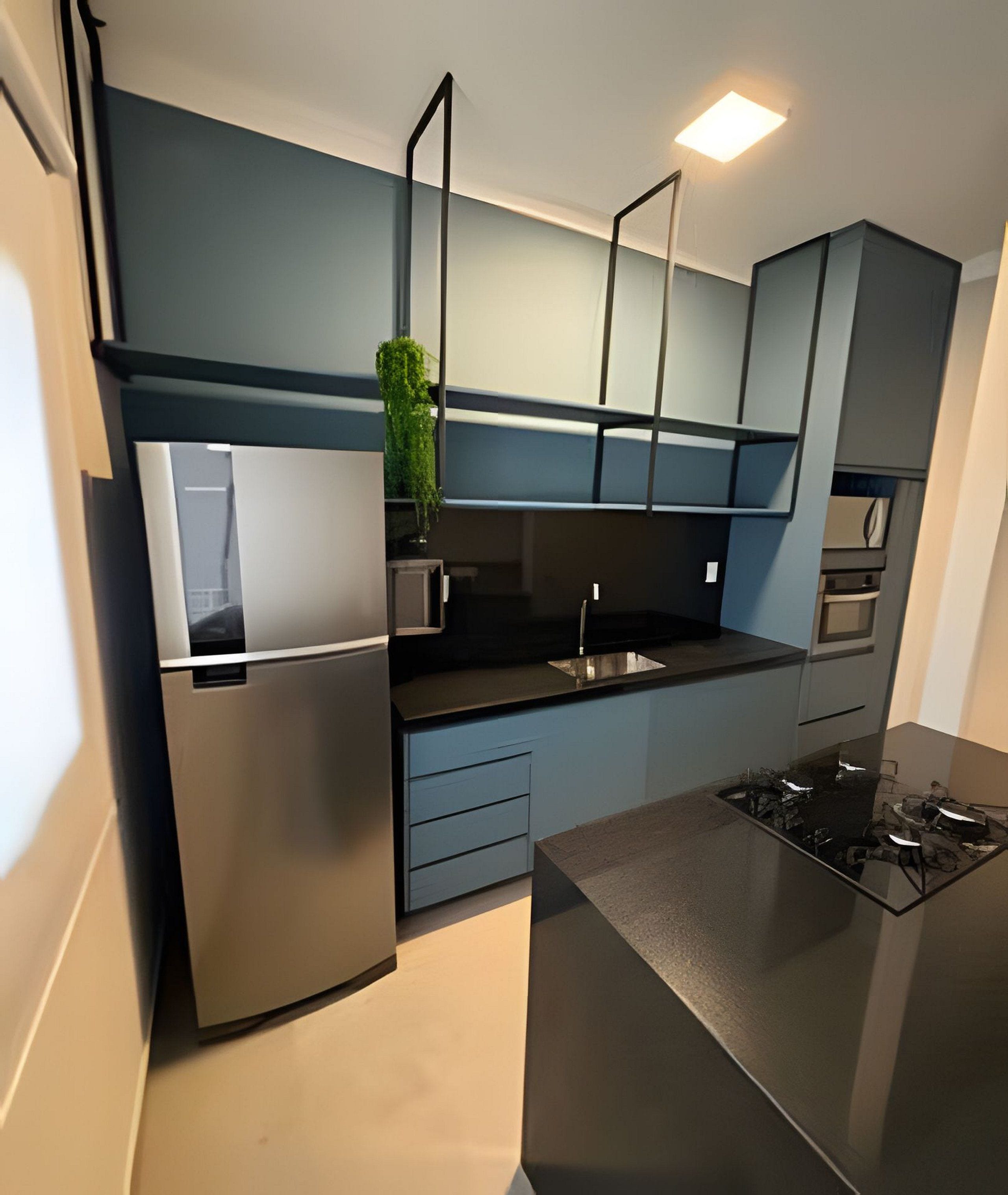 A modern kitchen with a built-in refrigerator, a gas stove, and a sink.