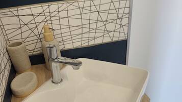 Shower, hair dryer, towels, toilet paper