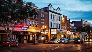 A street lined with historic buildings, including a theater and a commercial establishment. - NEW - Euro-Style Suite - Whyte Ave/Clean/A/C/NFLX/Sleeps6
 (Edmonton)