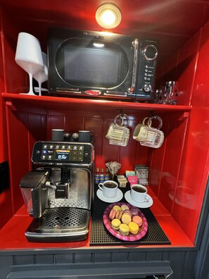 Microwave, coffee/tea maker, dining tables