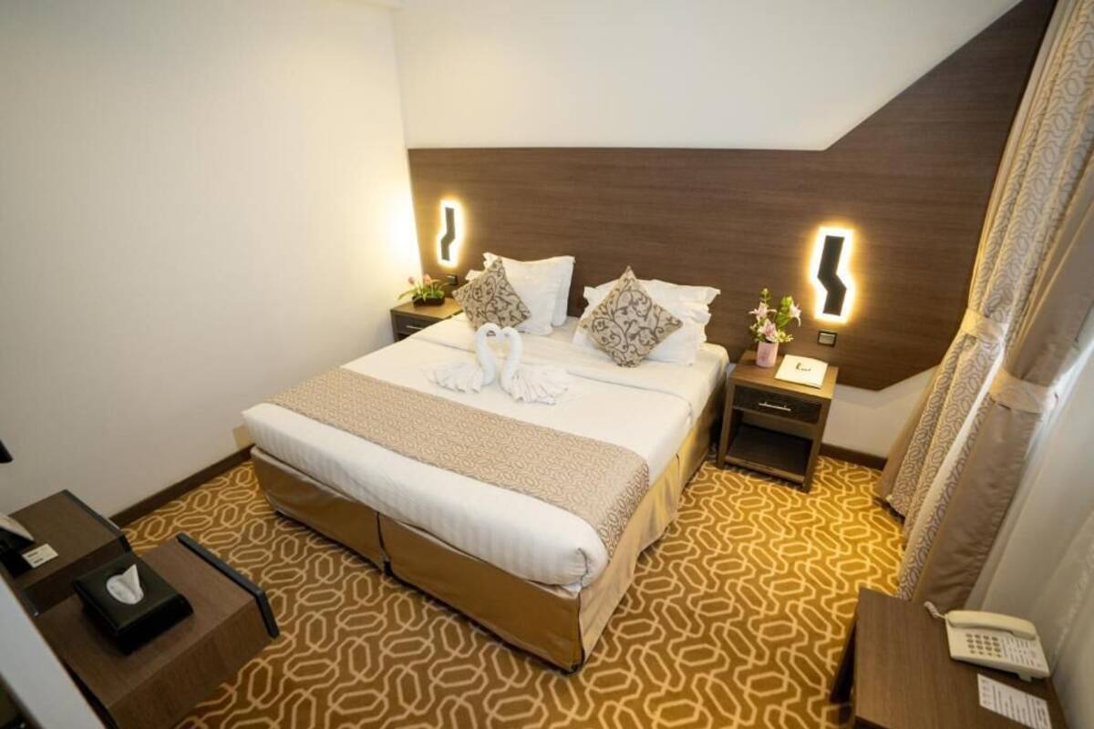 Deluxe eenpersoonskamer | Luxe beddengoed, een minibar, gratis wifi
