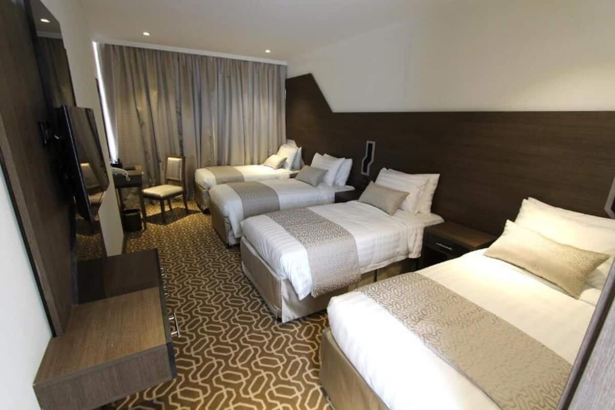 Standaard vierpersoonskamer | Luxe beddengoed, een minibar, gratis wifi