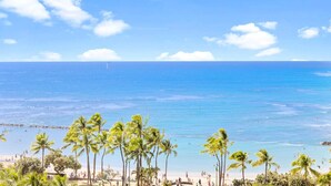 A beach with palm trees and a clear blue sky. - Oceanfront Condo W Free Valet Parking & Balcony (Honolulu)