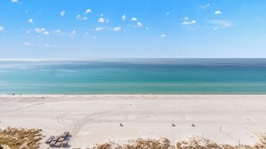 A wide sandy beach with a clear blue sky and calm sea. - Coral Reef, Unit #1102 (Beachfront 2 bedroom 2 bath condo on the 11th floor) (Panama City Beach)