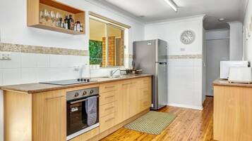 Fridge, oven, coffee/tea maker, cookware/dishes/utensils