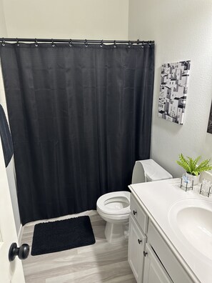 Jetted bath, hair dryer, towels, soap