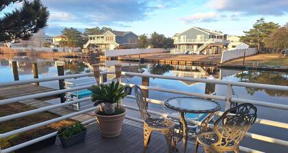 Sophisticated waterfront Sandbridge cottage on Back Bay, minutes to the ocean.