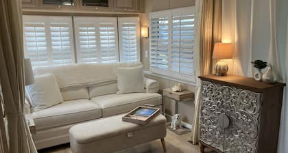 Sophisticated waterfront Sandbridge cottage on Back Bay, minutes to the ocean.