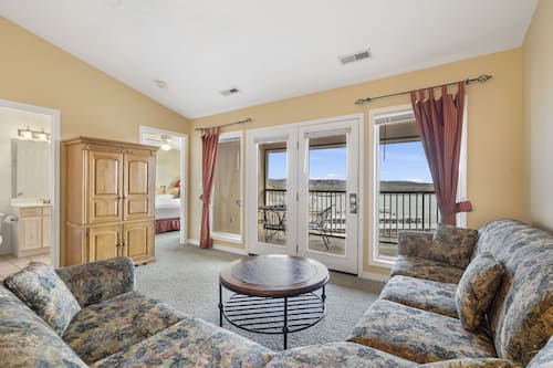 Standard Condo, 2 Bedrooms, Lake View | Living area | 32-inch flat-screen TV with cable channels