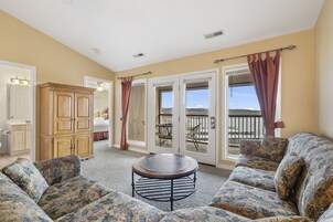 Standard Condo, 2 Bedrooms, Lake View | Living area | 32-inch flat-screen TV with cable channels