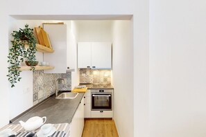 Fridge, oven, dishwasher, dining tables