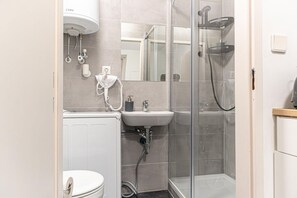 Shower, hair dryer, towels, soap