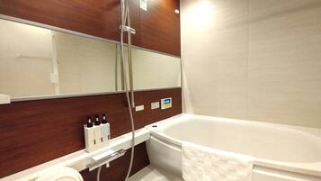 Separate bathtub and shower, free toiletries, hair dryer, slippers