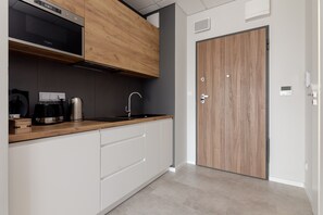 Fridge, microwave, stovetop, coffee/tea maker