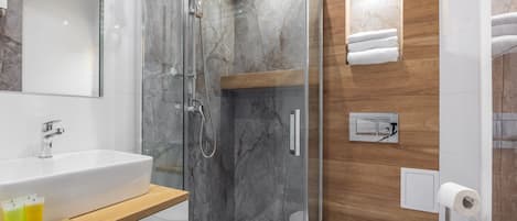 Shower, hair dryer, towels, soap