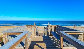 A wooden boardwalk leading to the beach with a clear view of the ocean. - SHEARWATER'S NEST - Single level 3 BR Home with Private Pool, 375 yards to beach (Southern Shores)