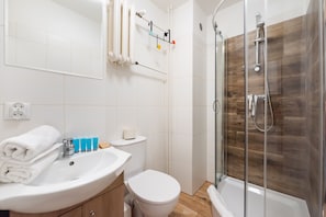 Shower, hair dryer, towels, soap